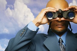 Man looking through binoculars